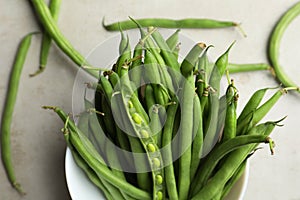 Fresh green beans on light grey table, flat lay