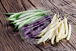 Fresh green beans on the old wood.