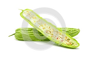 Fresh green bitter cucumbers sliced isolated on white background