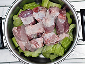 Fresh green bitter melon or bitter gourd sliced ready to cook