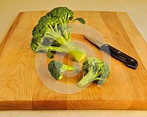 Fresh Green Broccoli on a Wooden Cutting Board.