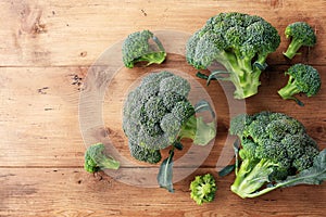 Fresh green broccoli on wooden table top view