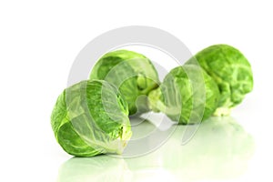 The Fresh green brussel sprouts vegetable on white background