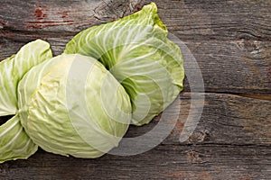 Fresh green cabbage on a wooden table