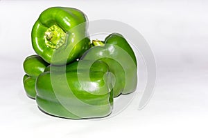 Fresh green capsicum over white isolated background