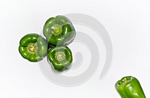 Fresh green capsicum over white isolated background