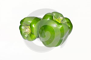 Fresh green capsicum over white isolated background