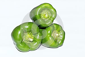 Fresh green capsicum over white isolated background