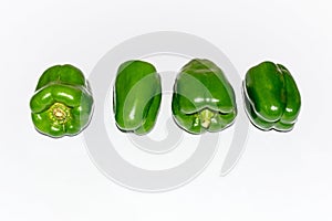 Fresh green capsicum over white isolated background