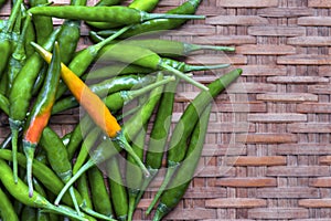 Fresh green chilli paste on bamboo background. Space left to place text.