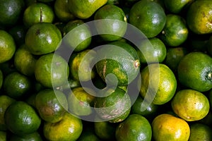 Fresh green citrus pilled together