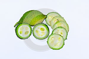 Fresh green colorful spiny gourd vegetables on white background photo