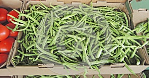 Fresh green flat beans for sale at the market