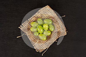 Fresh green grape on grey stone