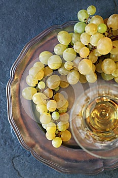 Fresh green grapes and glass of white wine