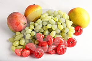 Fresh green grapes , mangoes and berrys.