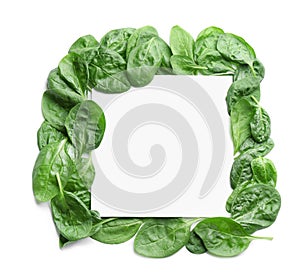 Fresh green healthy baby spinach leaves and blank card