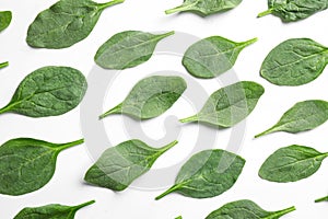 Fresh green healthy spinach leaves on white background