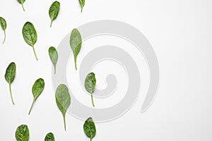 Fresh green healthy spinach on white background