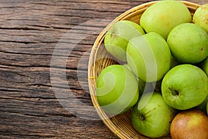 Fresh green jujube on wooden table