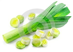 Fresh green leek stems and leek slices isolated on white background photo