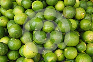 Fresh green limes from garden in the local market