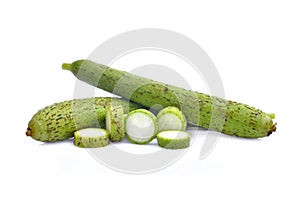 Fresh green loofah or luffa with slice isolated on white