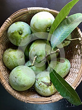 Fresh green moovandan mangoes