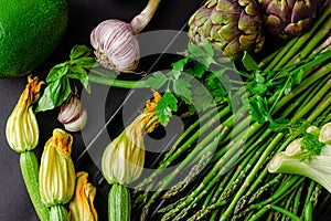 Fresh green organic vegetables on dark background. Healthy eating concept