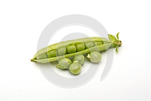 Fresh green pea pod with seeds on a white background