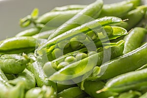 Fresh green pea seeds and pods - Close up