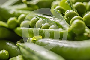 Fresh green pea seeds and pods - Close up