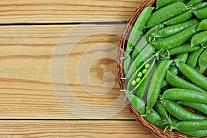 Fresh green peas in a basket