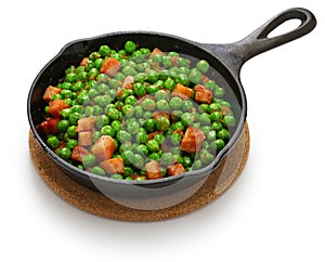 Fresh green peas with ham in skillet photo