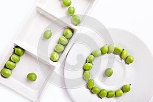 Fresh green peas on plate