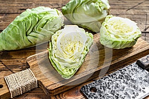 Fresh Green pointed cabbage. Wooden background. Top view
