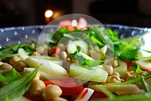 Fresh green salad on a glass bowl