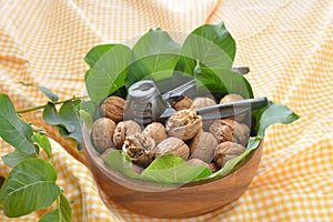 Walnuts with leaf and nutcracker