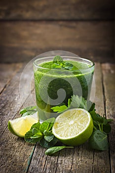 Fresh green smoothie with ingredients