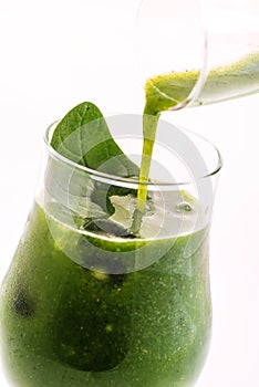 Fresh green smoothie with spinach leaf and lemon in glass isolated on white background, spinach, cucumber, apple fruit drink, prod