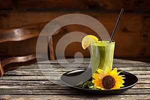 Fresh green smoothie on wooden table