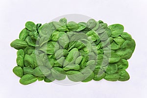 Fresh green spinach leaves on light background. Organic food. Top view, copy space