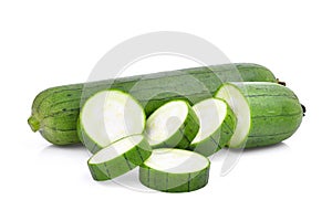 Fresh green sponge gourd or luffa with slice isolated on white