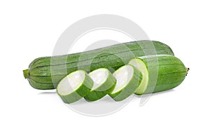 Fresh green sponge gourd or luffa with slice isolated on white