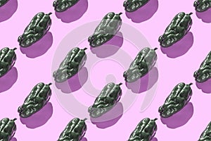 Fresh green ugly bell pepper seamless trend pattern isolated on pink background