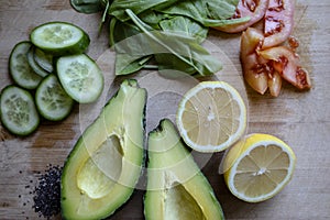 .Fresh green vegetables ready on cutting board, avocado,Cucumbers, Chia seed served in a bawl for breakfast. Gluten free meal,