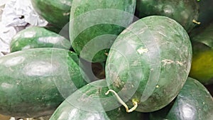 Fresh green watermelon on display on local fruit market selling in the local market