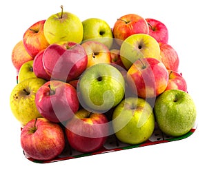 Fresh green, yellow and red apples on a tray.