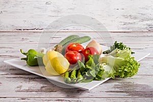 Fresh Green, Yellow and Red Vegetables on White Background