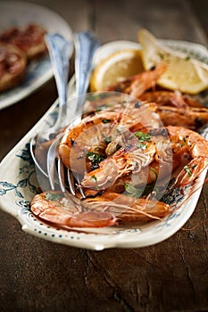 Fresh grilled large pink queen prawns photo